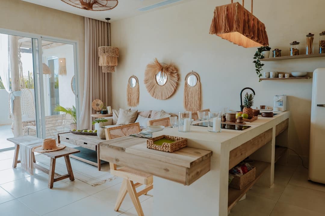 Warm modern kitchen and dining area with natural wood finishes and bohemian decor