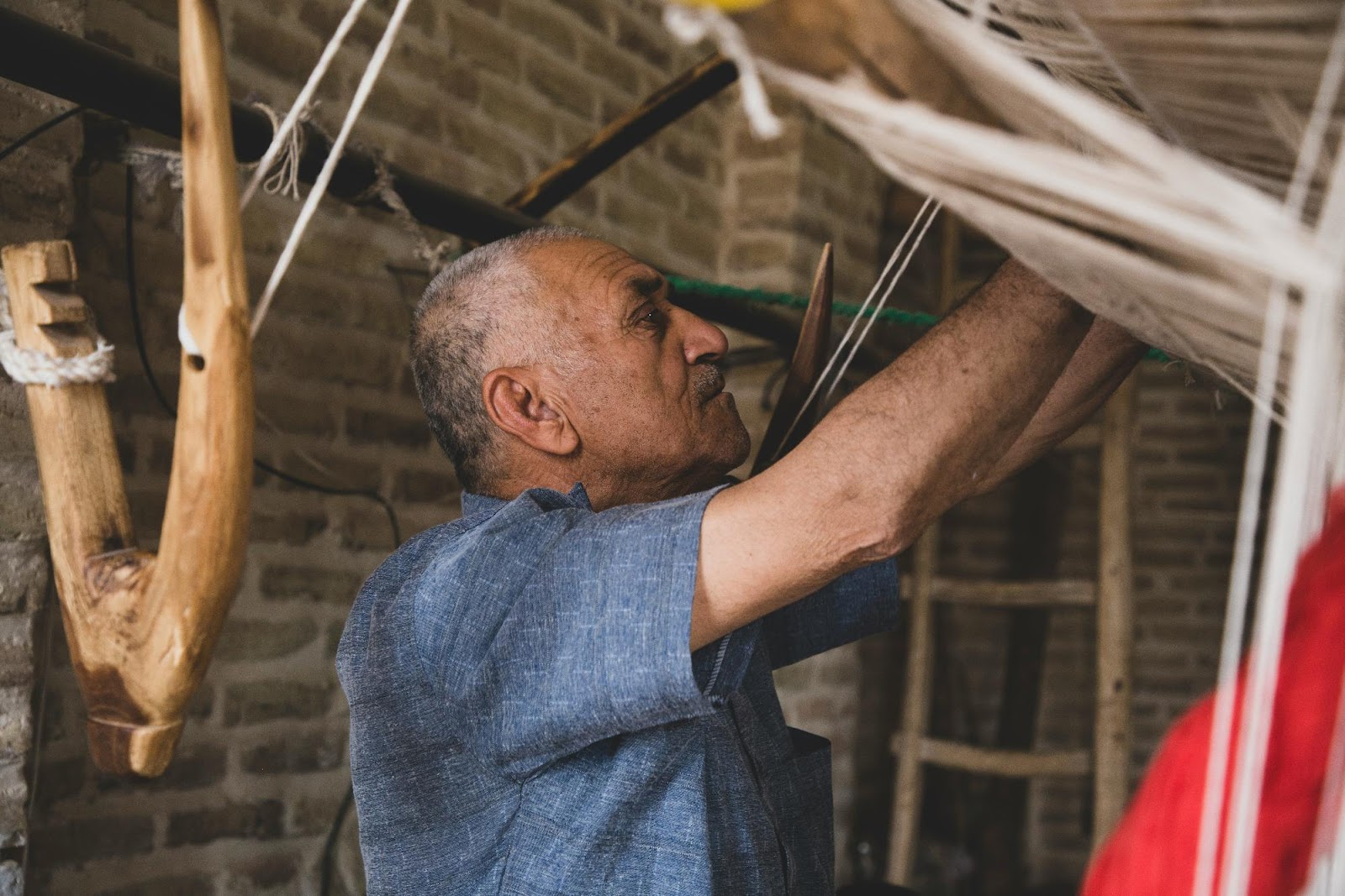 Man weaving fabric